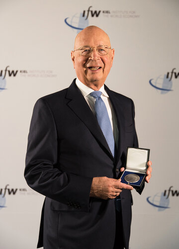 Klaus Schwab showing his medal