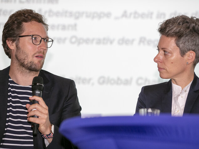 Two speakers on stage