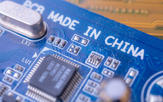 Made in china tag text on blue computer main board circuit
