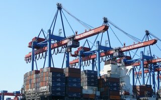 Cargo ship in the harbor of Hamburg Altenwerder