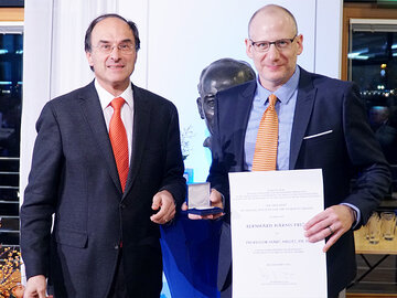Snower and Melitz presenting certificate