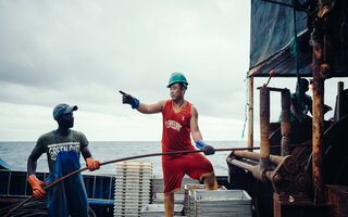 Two workers on a fishing boat
