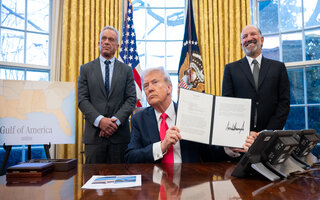 President Donald Trump signs executive orders in the Oval Office, Tuesday, February 25, 2025