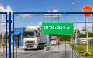 Trucks pass through the checkpoint of the customs logistics terminal
