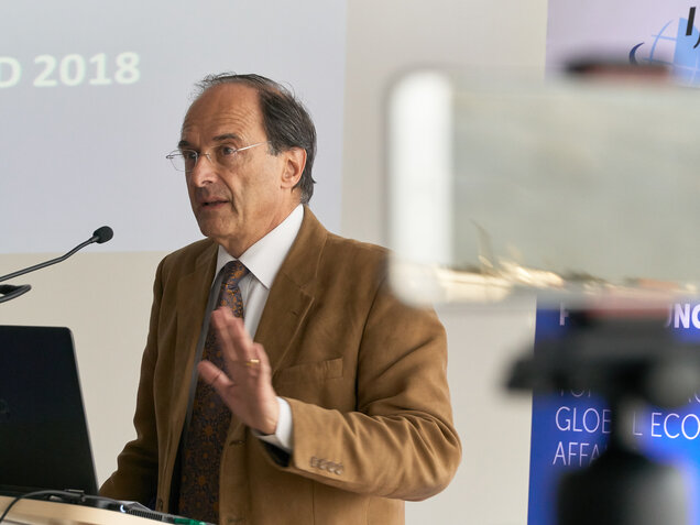 Dennis J. Snower speaking on stage