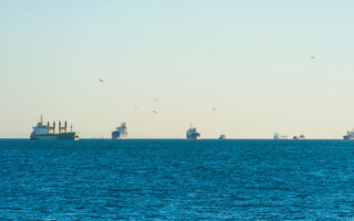 Many transport ships on blue sea, tanker cargo ships