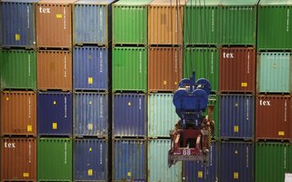 Stacked containers with transport vehicle in the front