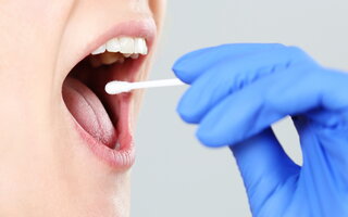 Person getting tested by taking probe from mouth