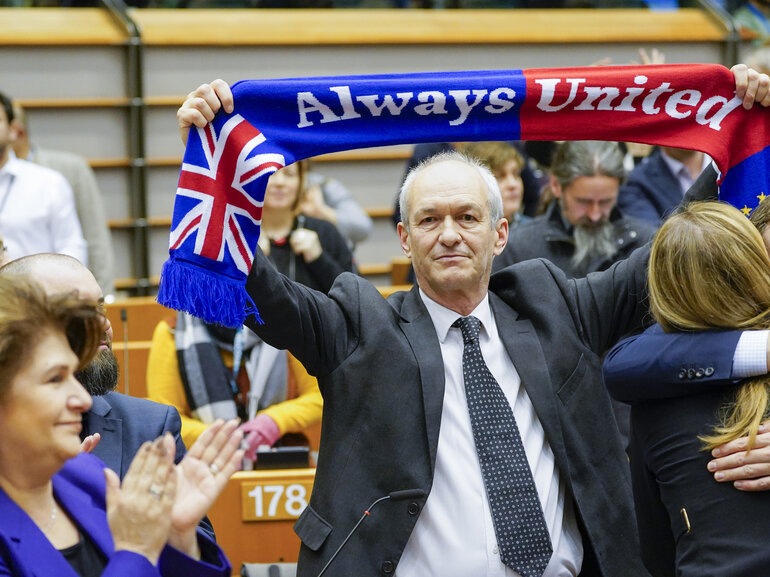 Man holding scarf with Union Jack and text "Always united"