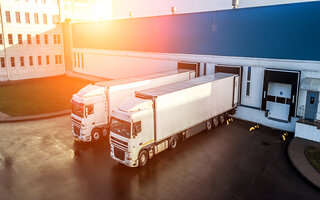 trucks are loaded in a modern logistics center